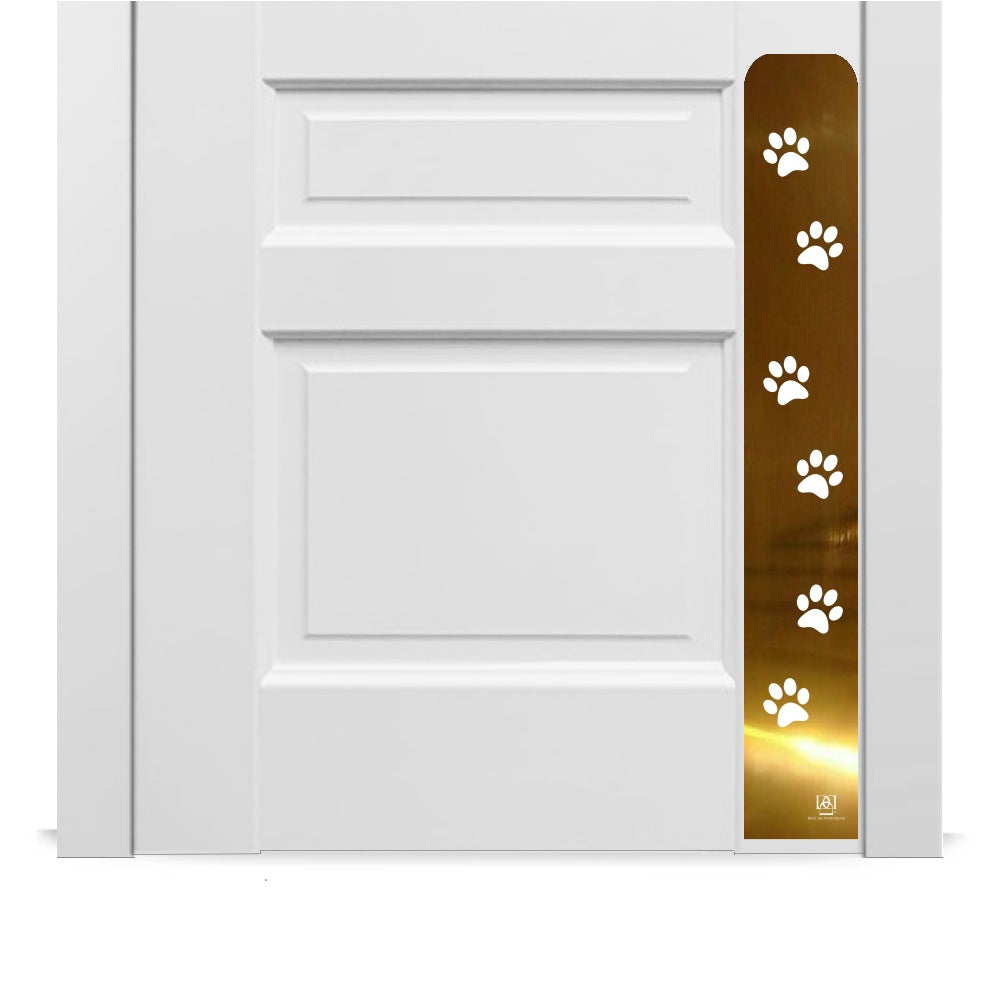 Engraved dog scratch protection plate with paw print in shiny brass