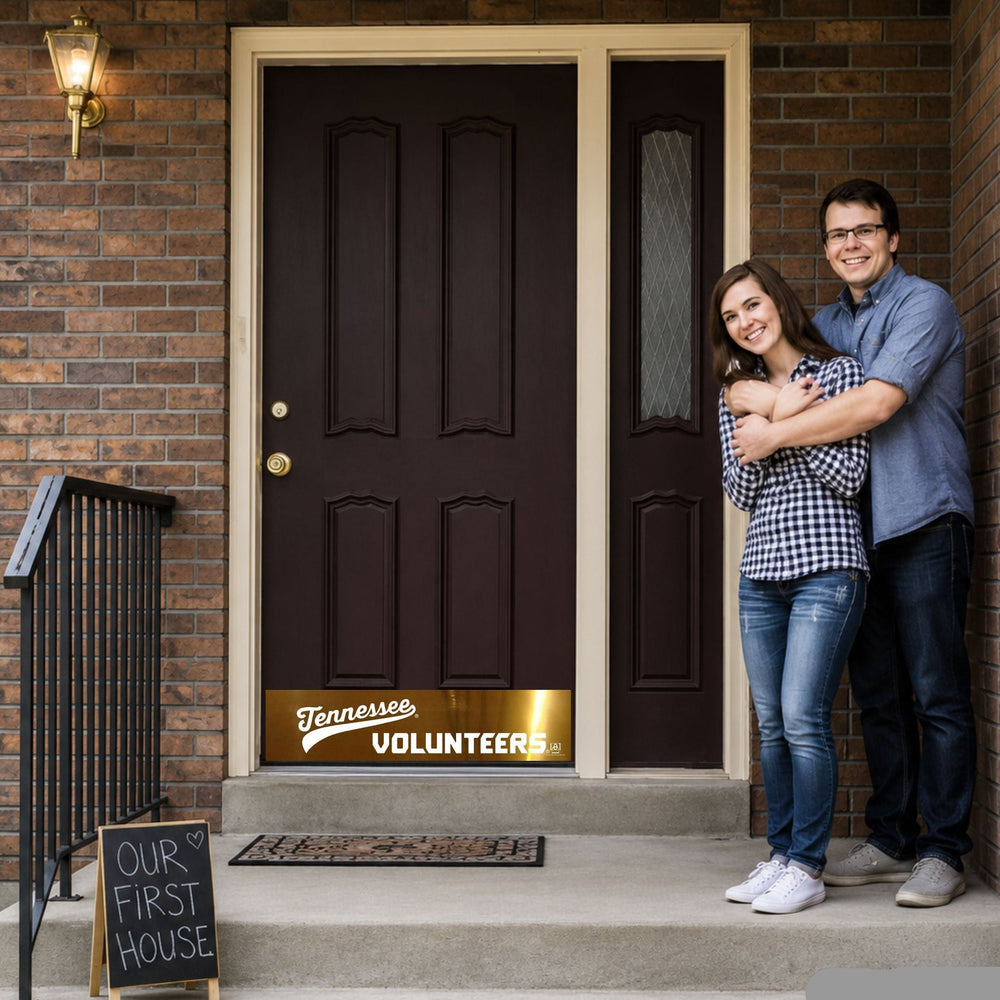 Young couple at new home front door with Tennessee Volunteers Door Kick Plate